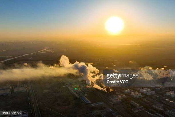 The 'super sun' rises over the city as Earth reaches its closest distance to the Sun, marking Perihelion Day, on January 3, 2024 in Yinchuan, Ningxia...
