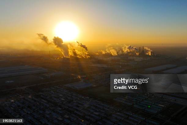 The 'super sun' rises over the city as Earth reaches its closest distance to the Sun, marking Perihelion Day, on January 3, 2024 in Yinchuan, Ningxia...
