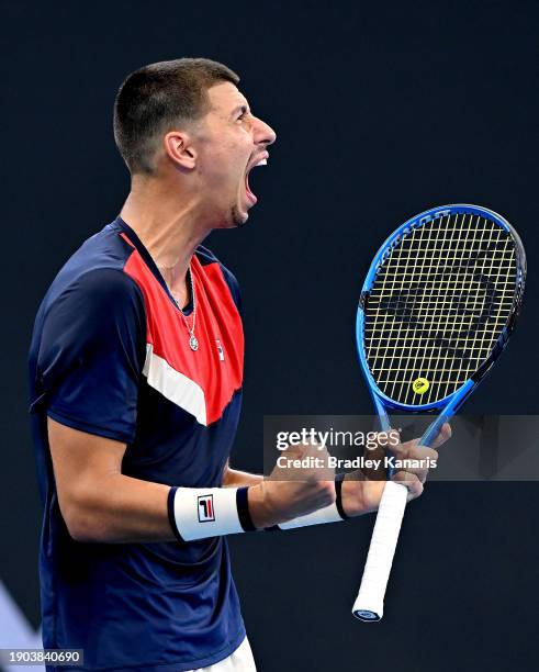 Alexei Popyrin of Australia celebrates after winning the first set in his match against Roman Safiullin of Russia during day four of the 2024...