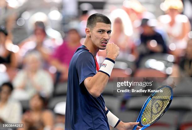 Alexei Popyrin of Australia celebrates after winning a point in his match against Roman Safiullin of Russia during day four of the 2024 Brisbane...