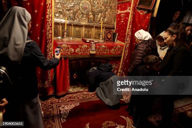 Orthodox Christians pray at the Church of the Nativity , built on a cave where Jesus Christ is believed to have been born, as part of the Christmas...