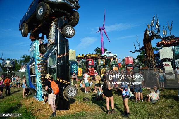 Festival goers gather at Carhenge during day 1 of Glastonbury Festival 2023 at Worthy Farm, Pilton on June 21, 2023 in Glastonbury, England.