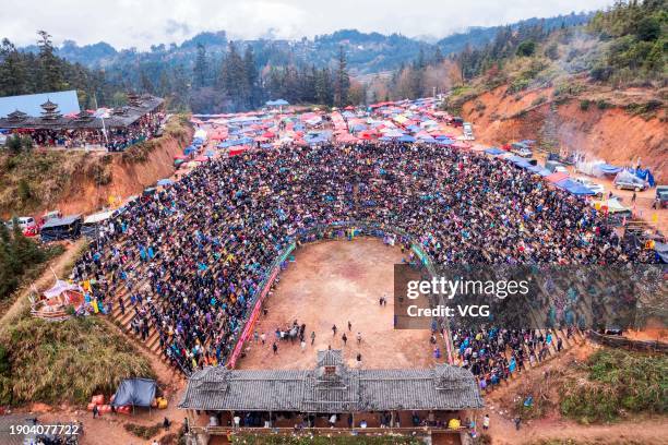 Aerial view of people watching a bull fighting competition on January 2, 2024 in Congjiang County, Qiandongnan Miao and Dong Autonomous Prefecture,...