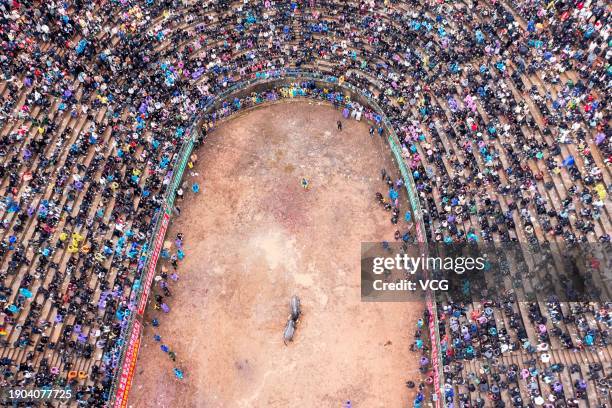 Aerial view of people watching a bull fighting competition on January 2, 2024 in Congjiang County, Qiandongnan Miao and Dong Autonomous Prefecture,...
