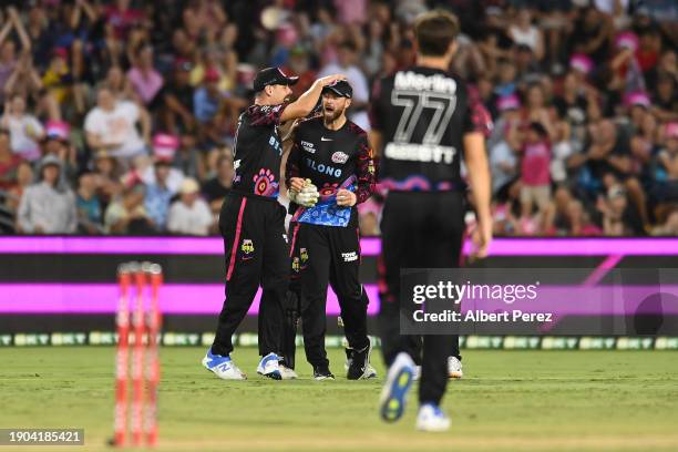 James Vince of the Sixers celebrates with team mates after catching out Colin Munro of the Heat during the BBL match between Sydney Sixers and...