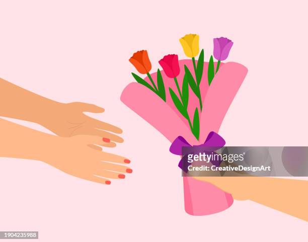 männliche hand, die tulpenstrauß an weibliche hand gibt. valentinstag, muttertag, frauentag oder geburtstag feiern - bouquet stock-grafiken, -clipart, -cartoons und -symbole