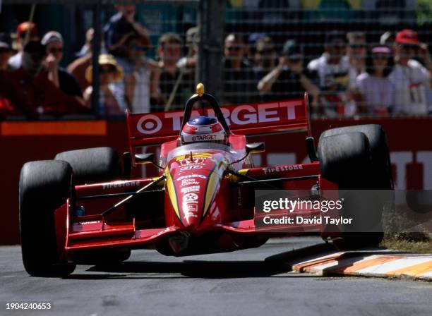 Jimmy Vasser from the United States drives the Target Chip Ganassi Racing Reynard 99i Honda HRS over the curbs during the Championship Auto Racing...