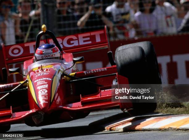 Jimmy Vasser from the United States drives the Target Chip Ganassi Racing Reynard 99i Honda HRS over the curbs during the Championship Auto Racing...