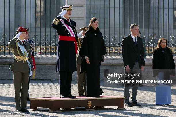 King Felipe VI of Spain and Spanish Crown Princess of Asturias Leonor salute next to Spain's Queen Letizia , Spain's Prime Minister Pedro Sanchez and...