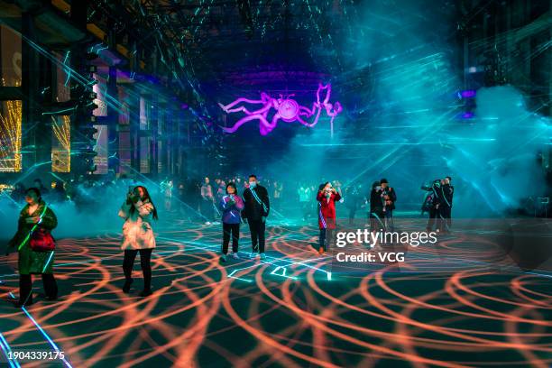 People visit the 2nd International Light and Shadow Art Festival at the Fine Arts Park on January 2, 2024 in Chongqing, China. The 2nd International...