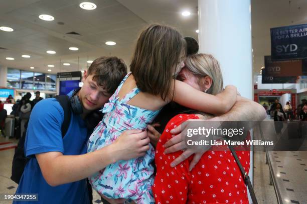 Alex Storozhuk is reunited with his family, wife Alla, son Mykola and daughter Yesenia on arrival to Sydney Airport on January 03, 2024 in Sydney,...