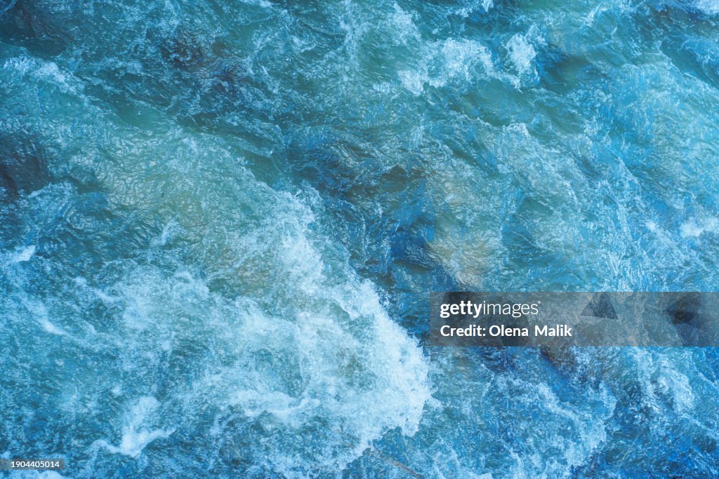 Close-up of a running water. Blue water surface
