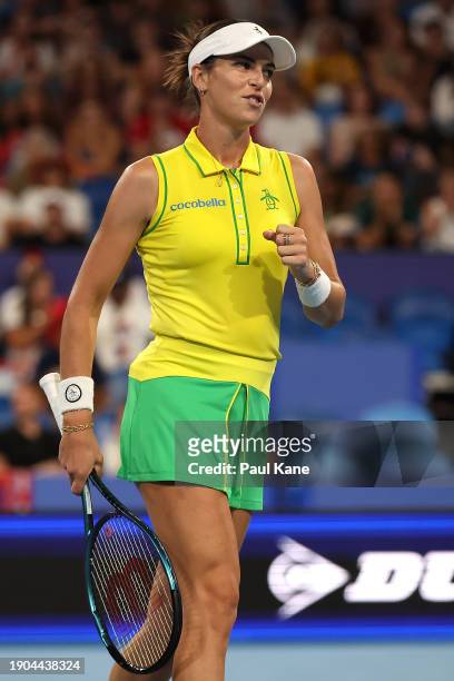 Ajla Tomljanovic of Team Australia celebrates winning a game in her singles match against Natalija Stevanovic of Team Serbia during day six of the...