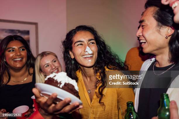 birthday cake smash - friends messing about stock pictures, royalty-free photos & images