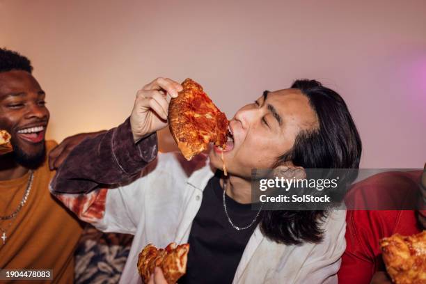 delicious pizza slice - guy with attitude mid shot stock-fotos und bilder