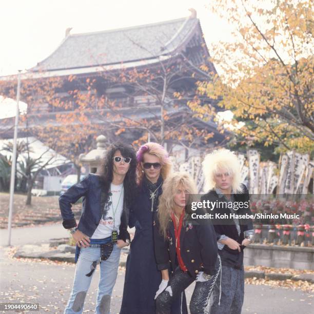 American band Poison, Bobby Dall, Rikki Rockett, Bret Michaels, C.C.DeVille, group portrait in front of a temple in Japan in November 1986.