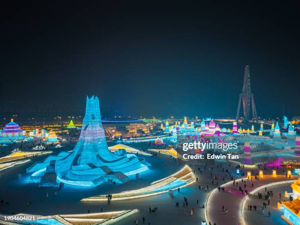 25th harbin, china ice and snow world at night - harbin stock pictures, royalty-free photos & images