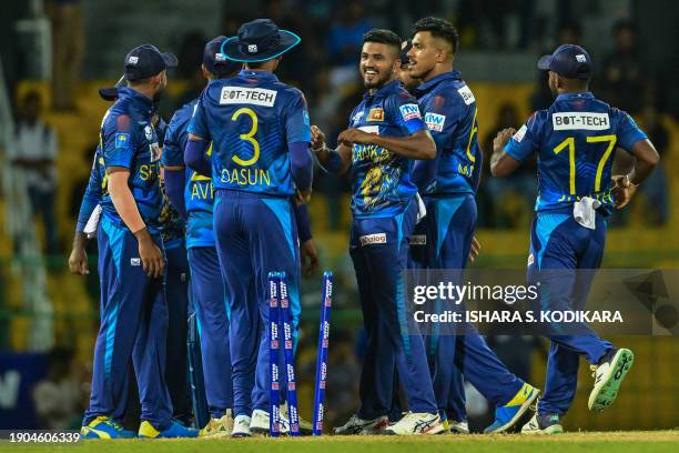 Sri Lanka's Dilshan Madushanka celebrates with teammates after taking the wicket of Zimbabwe's Tinashe Kamunhukamwe during the first one-day...