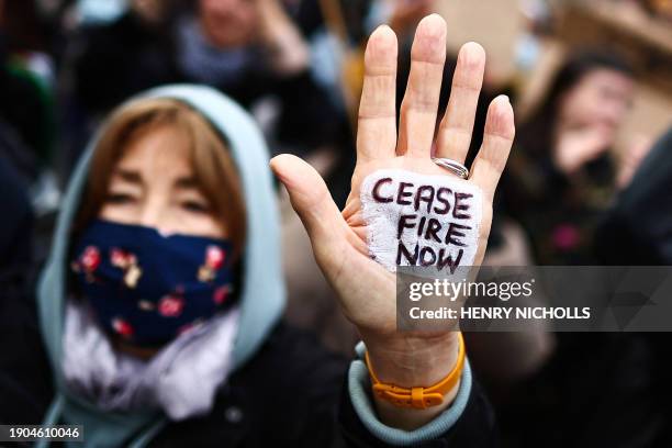 Pro-Palestinian supporter shows their hand reading "Cease fire now" during a demonstration in central London on January 6 calling for a ceasefire now...