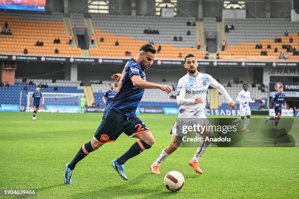 Deniz Turuc of Rams Basaksehir in action against Emre Akbaba of Yukatel Adana Demispor during the Turkish Super Lig week 19 football match between...