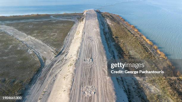 aerial photo of the sand road on the reclaimed land in amsterdam, ijburg - reclaimed stock pictures, royalty-free photos & images