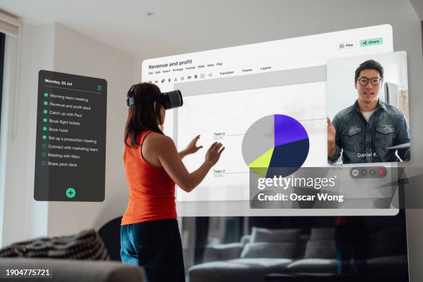 young woman in virtually reality headset interacting with multiple touch screens - virtual reality simulator presentation stockfoto's en -beelden
