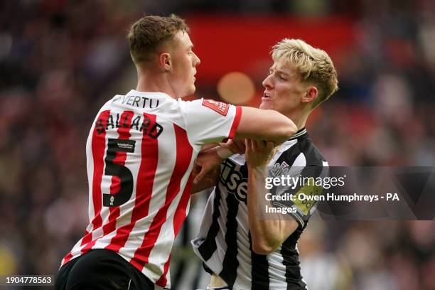 Sunderland's Daniel Ballard and Newcastle United's Anthony Gordon clash during the Emirates FA Cup Third Round match at the Stadium of Light,...