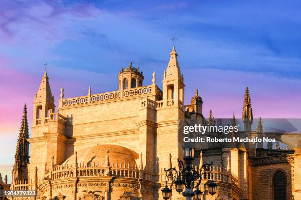 ancient cathedral building - seville cathedral stock pictures, royalty-free photos & images