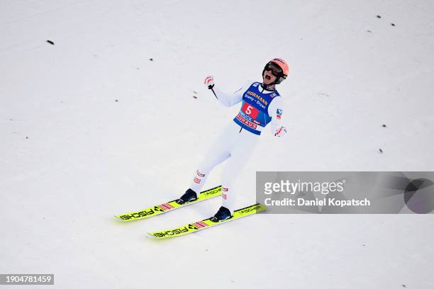 Jan Hoerl of Austria celebrates after competing in the Second Round Jump in the FIS World Cup Ski Jumping Four Hills Tournament Men Individual HS128...