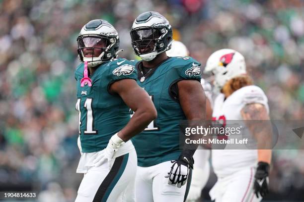 Nicholas Morrow of the Philadelphia Eagles and Fletcher Cox look on against the Arizona Cardinals at Lincoln Financial Field on December 31, 2023 in...