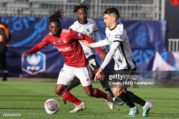 Brest's French defender Bradley Locko fights for the ball with Angers' midfielder Zinedine Ferhat during the French Cup football match between Stade...