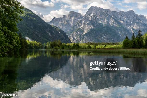 scenic view of lake and mountains against sky - andy dauer stockfoto's en -beelden