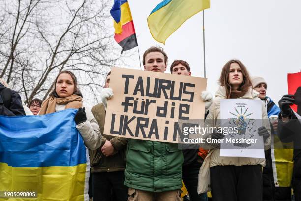 Protester holds a banner reading "TAURUS for Ukraine" as activists from the German-Ukrainian group Vitsche protest outside the Chancellery to demand...