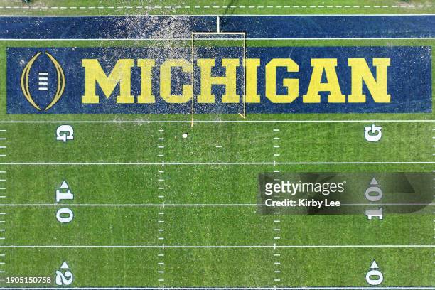 The Rose Bowl Stadium football field with Michigan Wolverines and College Football Playoff logos in the end zone on January 1, 2024 in Pasadena,...