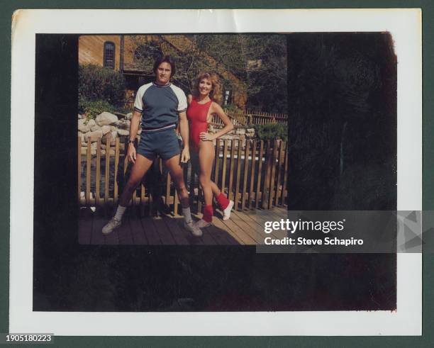 Married American couple, Olympic athlete Bruce Jenner and model & actress Linda Thompson Jenner stretch as they exercise together, Los Angeles,...