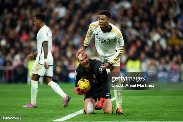 Jude Bellingham of Real Madrid interacts with Predrag Rajkovic of RCD Mallorca during the LaLiga EA Sports match between Real Madrid CF and RCD...