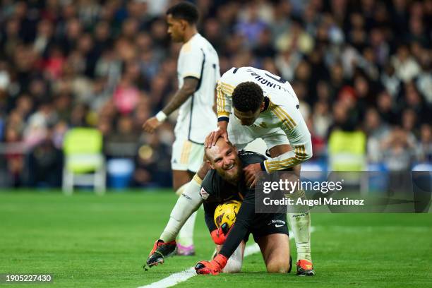 Jude Bellingham of Real Madrid interacts with Predrag Rajkovic of RCD Mallorca during the LaLiga EA Sports match between Real Madrid CF and RCD...