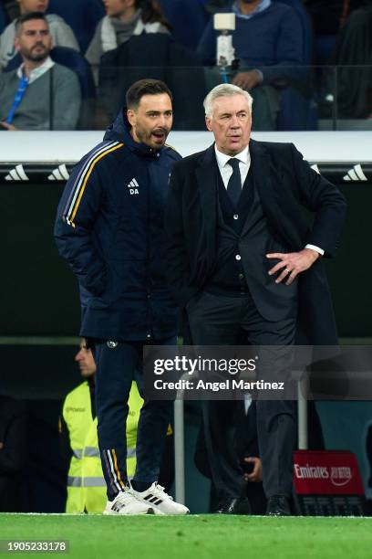 Assistant coach Davide Ancelotti of Real Madrid speaks to head coach Carlo Ancelotti of Real Madrid during the LaLiga EA Sports match between Real...