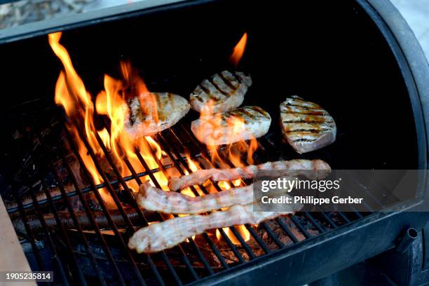 meat on bbq grill - smokey bacon stock pictures, royalty-free photos & images