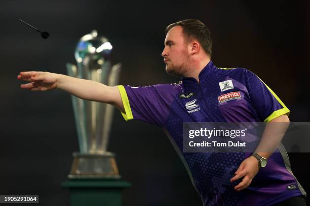 Luke Littler of England throws during the 2023/24 Paddy Power World Darts Championship Final between Luke Littler of England and Luke Humphries of...