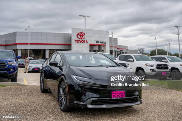 Toyota vehicles are seen for sale on a dealership lot on January 03, 2024 in San Marcos, Texas. Auto sales rose sharply within the first nine months...