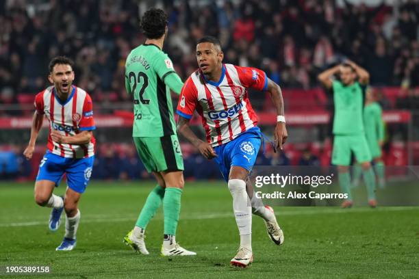 Savio of Girona FC celebrates after scoring their team's second goal during the LaLiga EA Sports match between Girona FC and Atletico Madrid at...