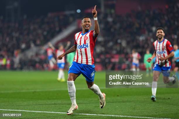 Savio of Girona FC celebrates after scoring their team's second goal during the LaLiga EA Sports match between Girona FC and Atletico Madrid at...