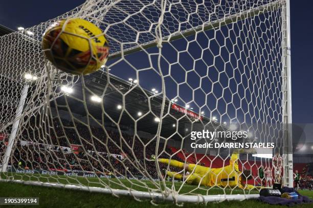 Stoke City's English midfielder Lewis Baker scores their second goal from the penalty spot during the English FA Cup third round football match...