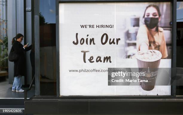 Join Our Team' sign is posted outside a coffee shop on January 03, 2024 in Los Angeles, California. U.S. Job openings fell to 8.79 million in...