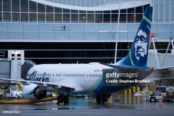 An Alaska Airlines Boeing 737 MAX 9 plane sits at a gate at Seattle-Tacoma International Airport on January 6, 2024 in Seattle, Washington. Alaska...