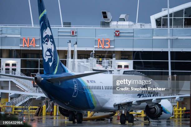 An Alaska Airlines Boeing 737 MAX 9 plane sits at a gate at Seattle-Tacoma International Airport on January 6, 2024 in Seattle, Washington. Alaska...