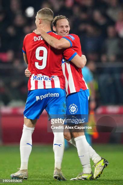 Daley Blind of Girona FC celebrates with teammate Artem Dovbyk after scoring their team's third goal during the LaLiga EA Sports match between Girona...