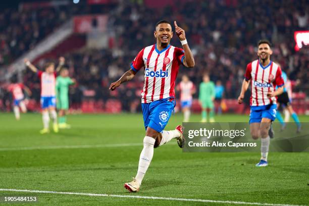 Savio Moreira of Girona FC celebrates after scoring his team's second goal during the LaLiga EA Sports match between Girona FC and Atletico de Madrid...