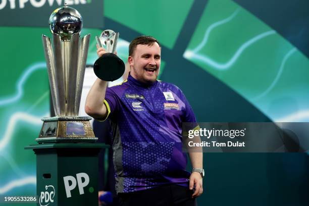 Runner-up Luke Littler of England celebrates with the runner-up trophy after the 2023/24 Paddy Power World Darts Championship Final between Luke...